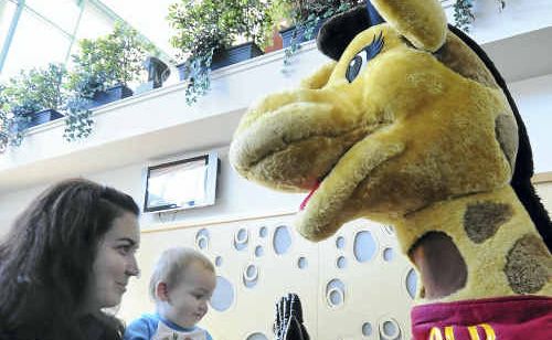 Brooke Farnsworth introduces 19-month-old-son Joe to Harold the Life Education giraffe. Brooke Farnsworth introduces 19-month-old-son Joe to Harold the Life Education giraffe.